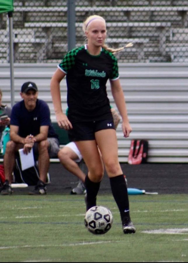 Senior soccer player Abby Matson  dribbles the ball while trying to advance it upfield. Matson says that her favorite thing about playing soccer at WJ is the team bond and rivalry against schools particularly BCC.