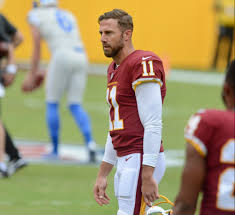 Alex Smith watches on during pregame warm-ups as he unknowingly prepares for what will be his first game with playing time since his leg injury in 2018. He has since then led Washington to a 5-7 record and second place spot in the division.