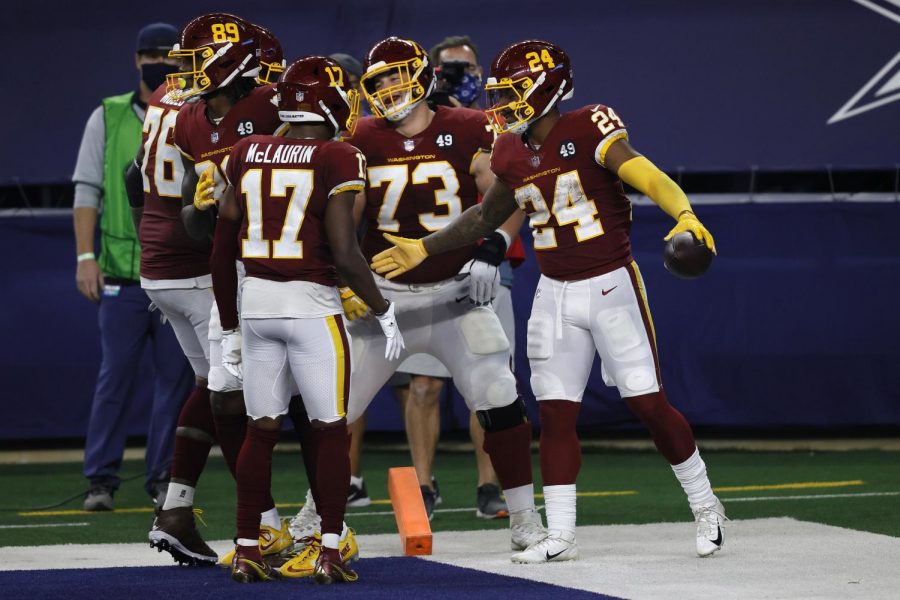 Washington Football Team players celebrate one of Antonio Gibsons three touchdowns in a Thanksgiving day win over Dallas.