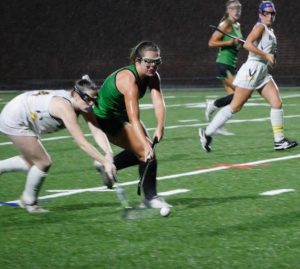 Senior Ellie Poersch fights for the ball in a senior night match up against BCC. Poersch has been on the team since her freshman year, and will miss the spirited game days the most.