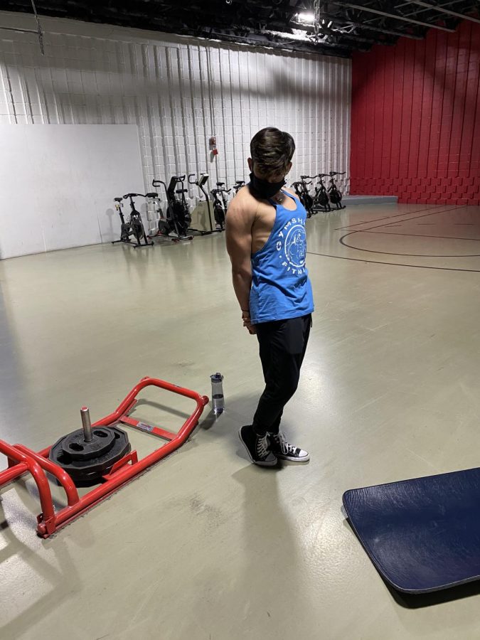 Ayuni poses in front of the camera after his workout at his local gym.