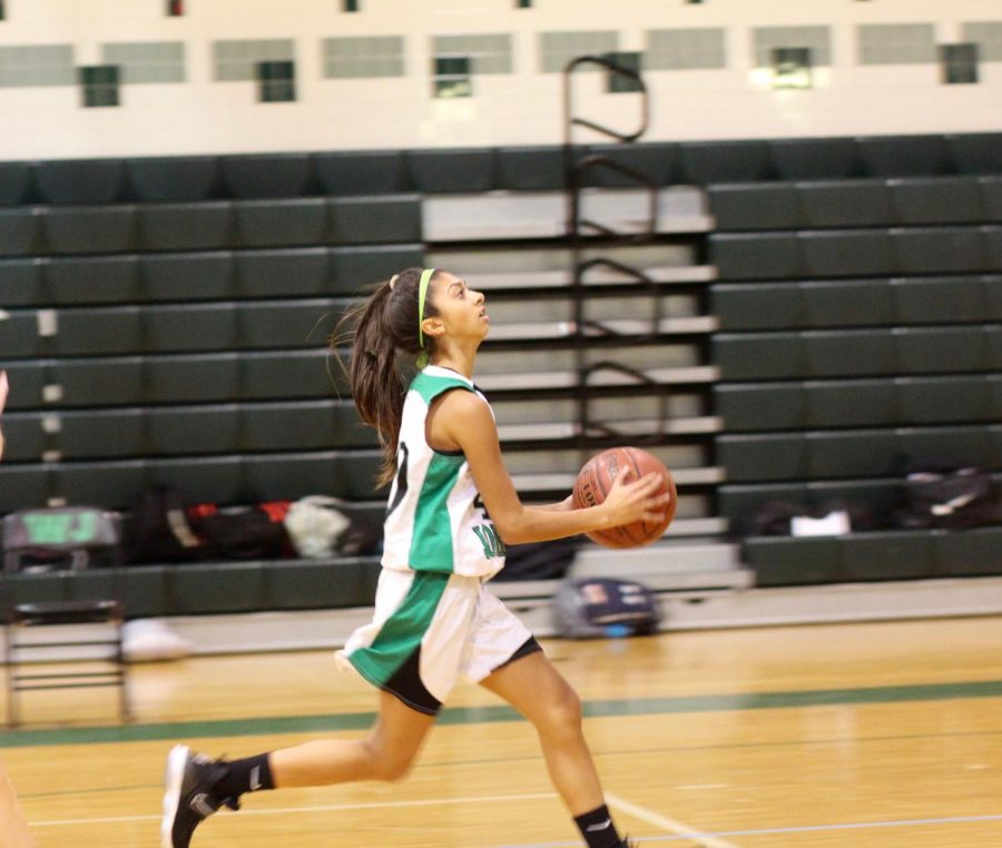 Senior Hannah Sarnowski goes for a shot during a WJ Basketball game.  Sarnowski wishes she could have one last season with her team.