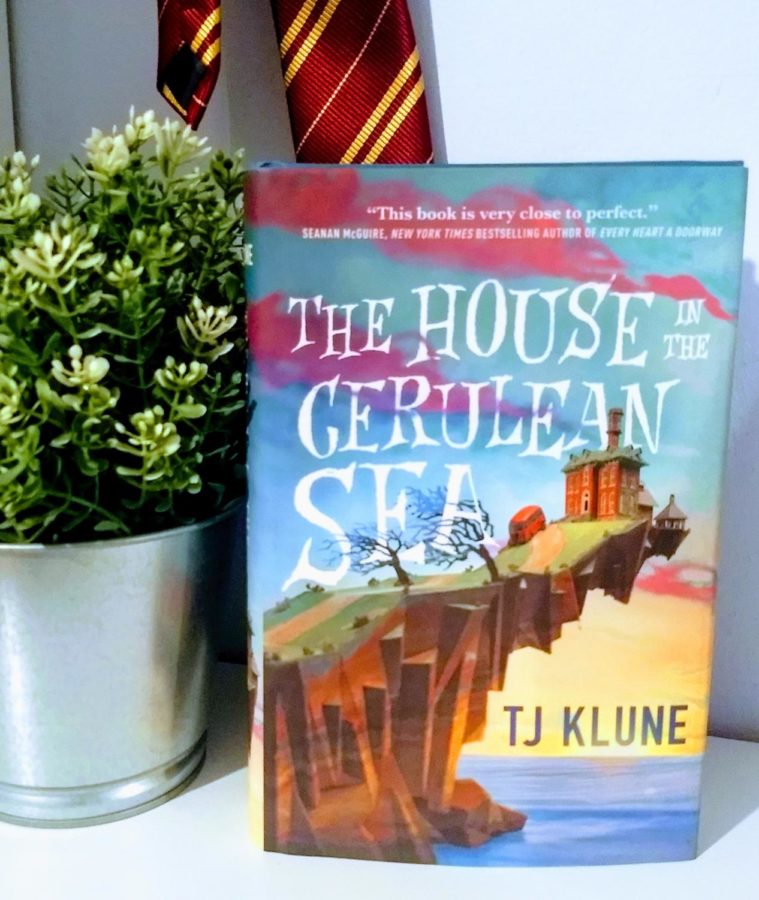 The House in the Cerulean sea, by TJ Klune, is a heartwarming tale of found-family and overcoming prejudice. In this stunning novel filled with magic, laughs and love Klune envelopes you in a hung (in the form of a book).
