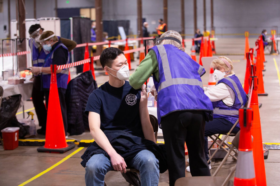 A person receives a dose of the COVID-19 vaccine at a vaccination site in Baltimore, MD. As all Americans 16 and older will be eligible for the COVID-19 vaccine by April 19, younger people are becoming increasingly eager for a vaccine to be approved for their age range