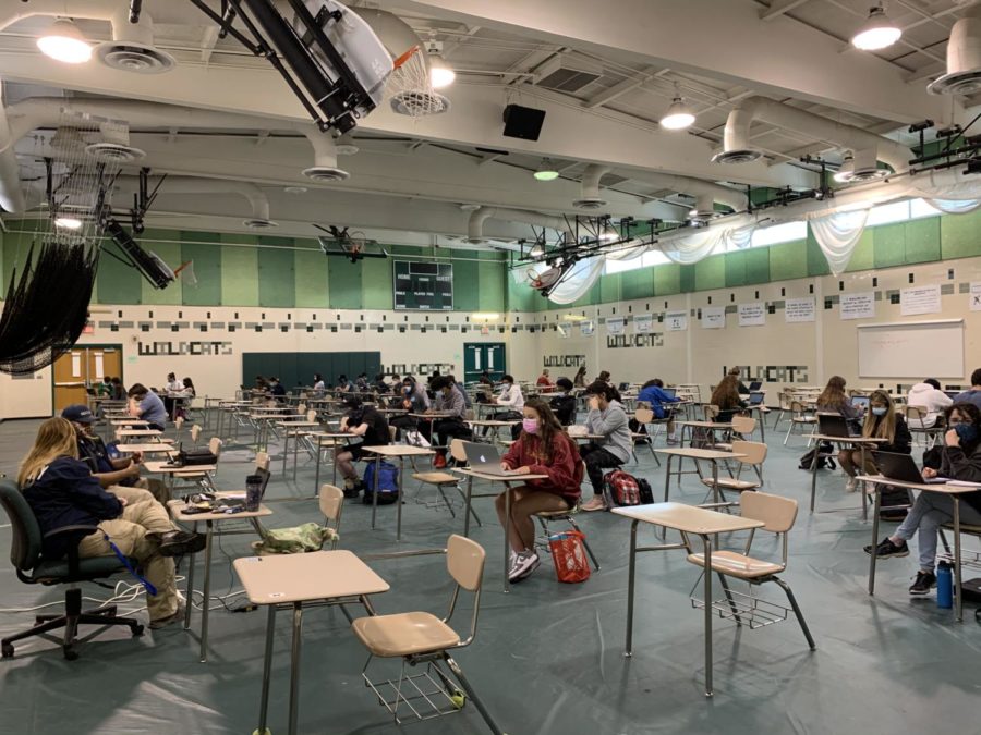 Students signed up for in-person schooling gather in the auxilary gym to attend Zoom classes for their teachers who opted to stay online due to health concerns. In-person schooling will not look like what it is now as MCPS is planning on returning to the full 5-day schedule at normal capacity for the 2021-2022 school year.