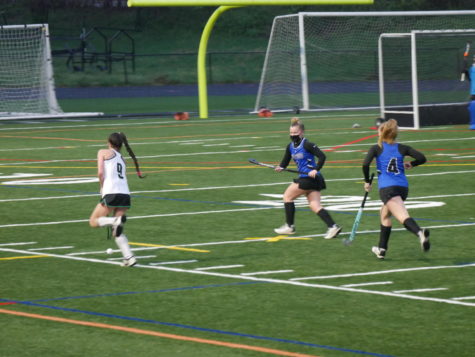 Forward Kate Aschenbach (9) brings the ball up field for an offensive possession.