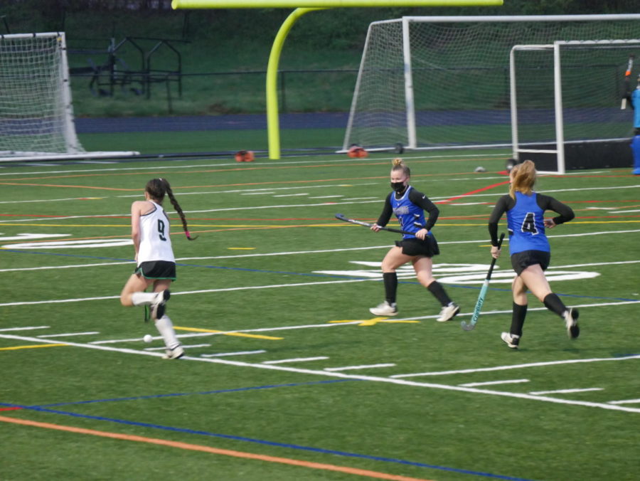 Forward Kate Aschenbach (9) brings the ball up field for an offensive possession.