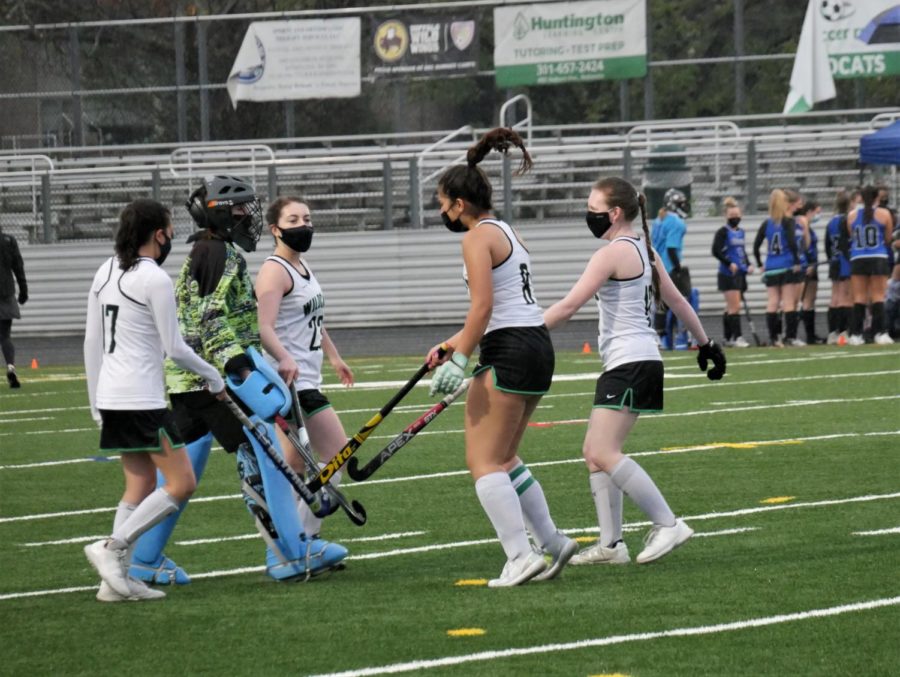 The starting defense breaks it down before the game begins against Sherwood.