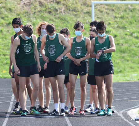 The team lines up in preparation for their race. Alex Scott (far left) and Adam Morad (far right) have been stand outs this season, consistently performing well in their meets.