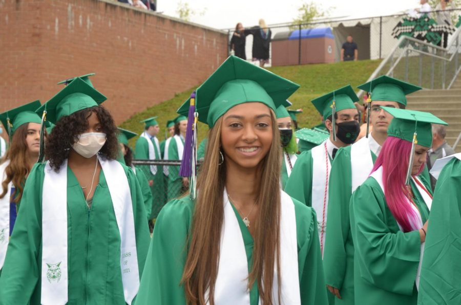 Senior+Hannah+Sarnowski+walks+to+her+seat+before+the+graduation+ceremony+begins.+Graduation+-+held+on+the+football+field+-+was+one+of+many+events+held+to+celebrate+this+years+senior+class