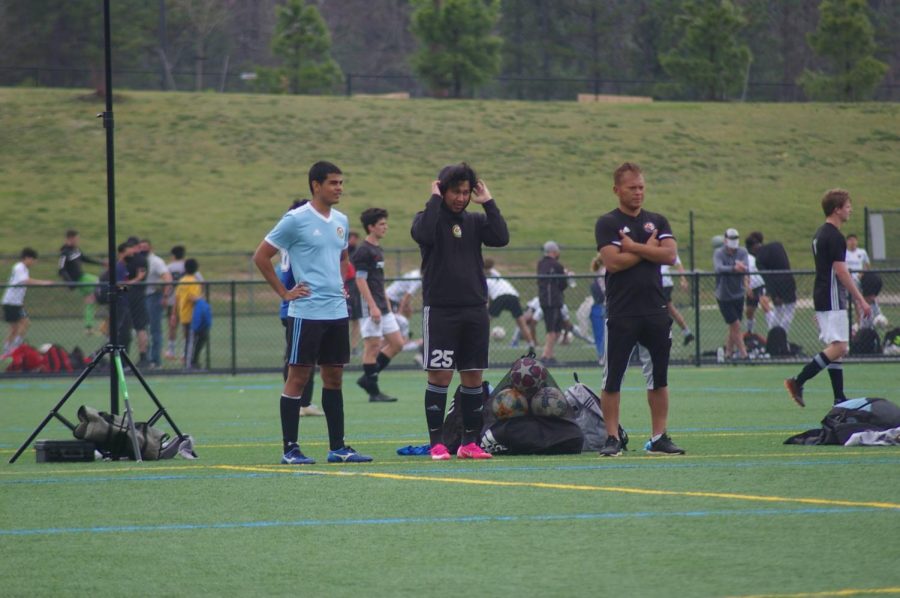 Oscar Guerro watches his team from the sidelines of their final Jefferson Cup game. Guerro started coaching his first son Diego 15 years ago. This is his second team for his second son Anderson.