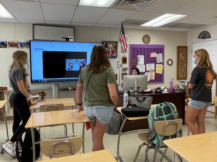 Spanish Honor Society student officers work with their sponsor Amanda McAndrew to test out a Zoom link that would allow members in the Virtual Academy to attend club meetings. Zoom meetings were mainly used by students prior to August 2021 to attend virtual school, but are now generally reserved for clubs and Virtual Academy students as in-person schooling resumed.