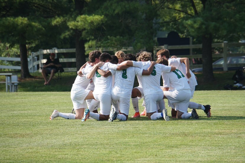 WJ soccer huddles up prior to the 2021 season. They finished with a 3 game win streak last season and look to keep it up.