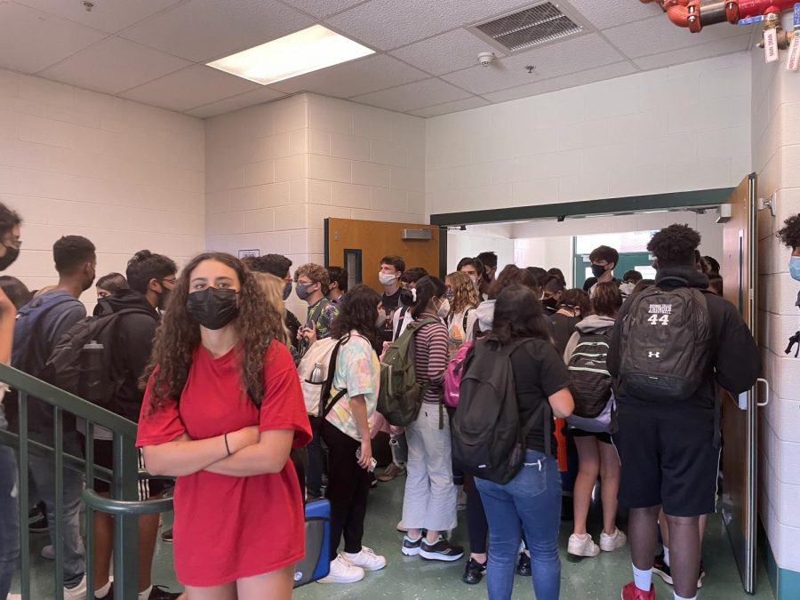 Walter Johnson students wade through the crowded stairwells trying to get to class. Many find the slow, jammed hallways a difficult adjustment, especially after distancing for so long.