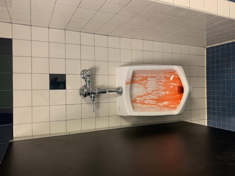 Kool-Aid is found covering a urinal in the boys bathroom. Covering bathrooms in Kool-Aid is a recent trend that has surfaced on TikTok.