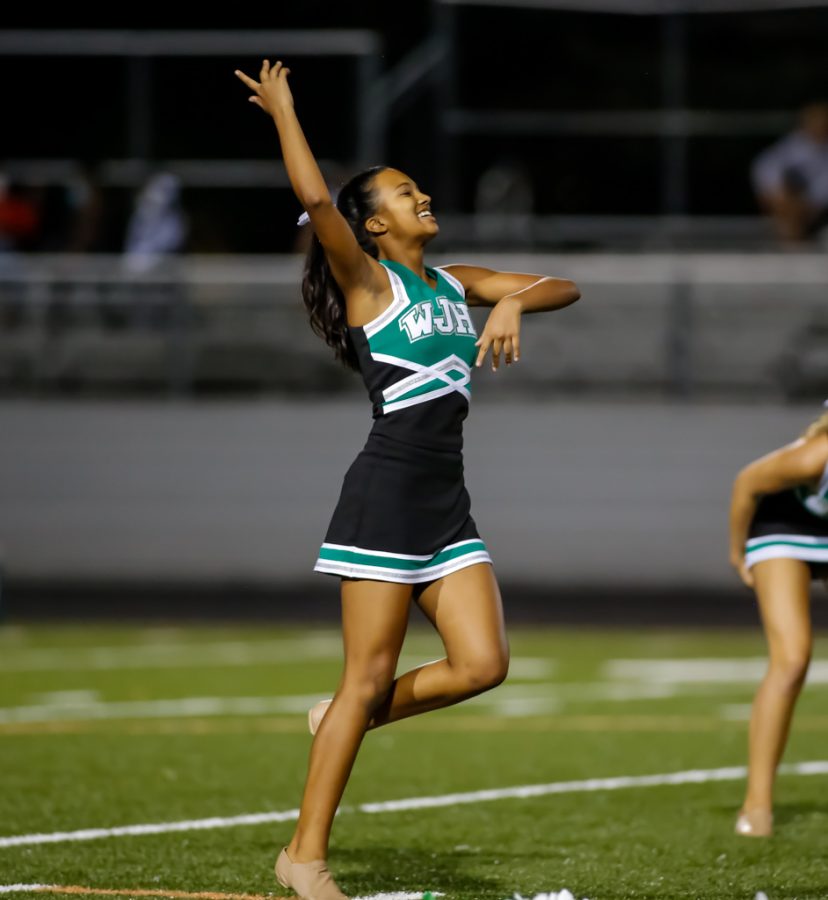 Sophomore Madison Fraser finishes her first homecoming game performance with Poms. This performance was a longer version of their usual routine and was a crowd favorite.
