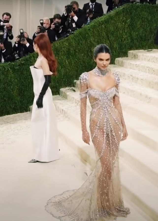 Model Kendall Jenner poses for the paparazzi in a dress by Givenchy. The look was inspired by Audrey Hepburns dress in My Fair Lady. This is Jenners seventh year attending the Met Gala.