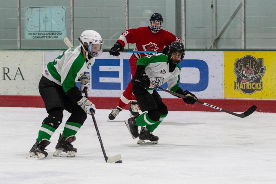 Justin Davids and Ethan Birndorf race down the ice for a breakaway opportunity. Davids and Birndorf have played both hockey since a young age and decided to continue their careers at WJ.