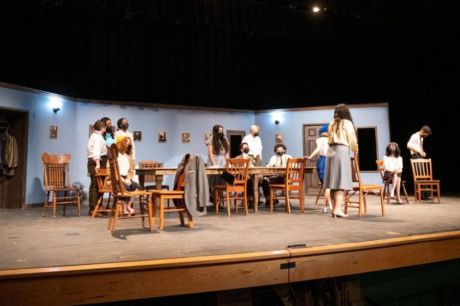 Cast members practice their lines and movements in the jury room set in their rehearsal on Nov. 11. The show had an almost entirely new cast whereas, before the pandemic, members usually would grow up with the cast, with only a few new members introduced each year.