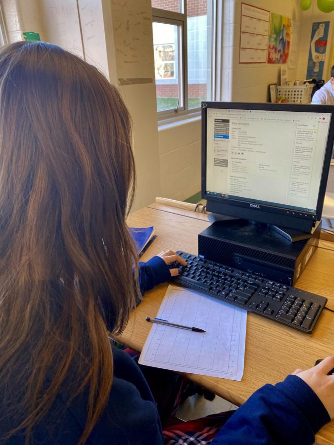 Students glance at their college lists during class. During this time waiting for the college process could be nerve-racking so having a place where you can look at all your colleges is nice.