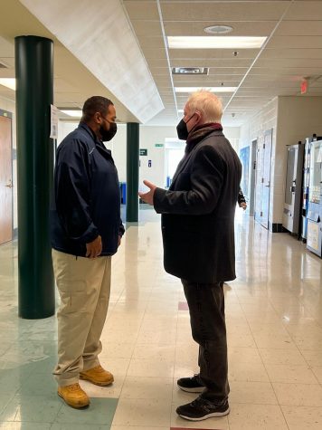Security guard James Etheridge and English teacher William Griffiths discuss students being late to class. Security guards and teachers check the hallways to see if students are skipping class.