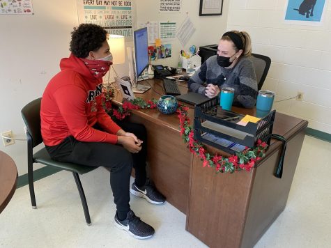 Junior CJ Newman speaks with school counselor Ashley Weddle. They discuss new classes for next year and how they can fit into his schedule.