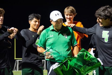 Head Coach Hector Morales receives an award for all he has contributed to the Walter Johnson soccer program. Seniors (from left) Mathew Eisenbrey, Fernando Ibarra, Leo Dobosz, and Alejandro Linares surround him.