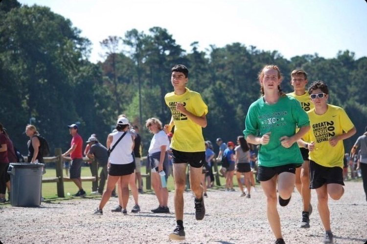 Senior Zeke Ross is running in a meet  and trying to pace himself so his team  can win the competition. Ross reflection about bieng on cross country is  Being in xc is all about being with your friends and  pushing  your body further than you think you can.
