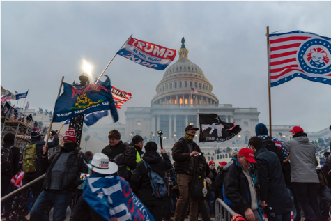 Trump supporters stand outside the US Capitol in an act of defiance over the 2020 election results. As a result of Trumps extremist opinions, so much of his base have been entirely radicalized. Conspiracy theories and QAnon became a large source of information for many.