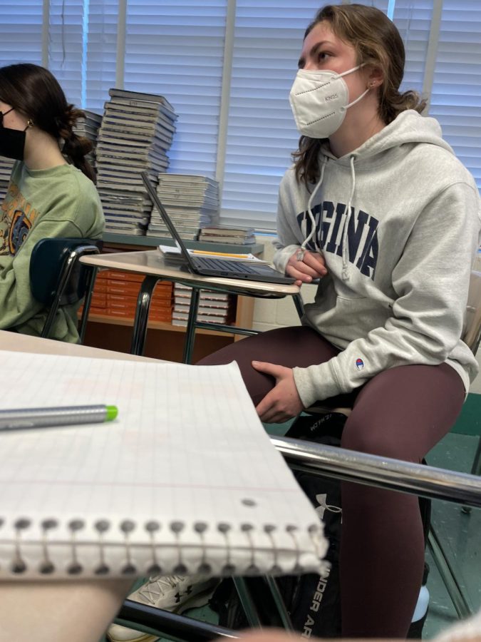 Junior Olivia McCloskey pays close attention in class while wearing her KN-95 mask. “Since the KN-95 masks are said to be the best at keeping Covid away, I chose to wear one at school because it makes me feel safer,” McCloskey said.