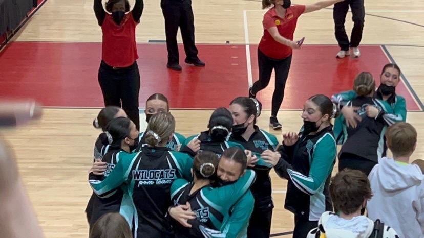 The+Poms+team+celebrates+after+hearing+they+got+first+place+for+the+county+competition.+They+now+have+the+potential+to+become+D1+depending+on+their+performance+next+season.