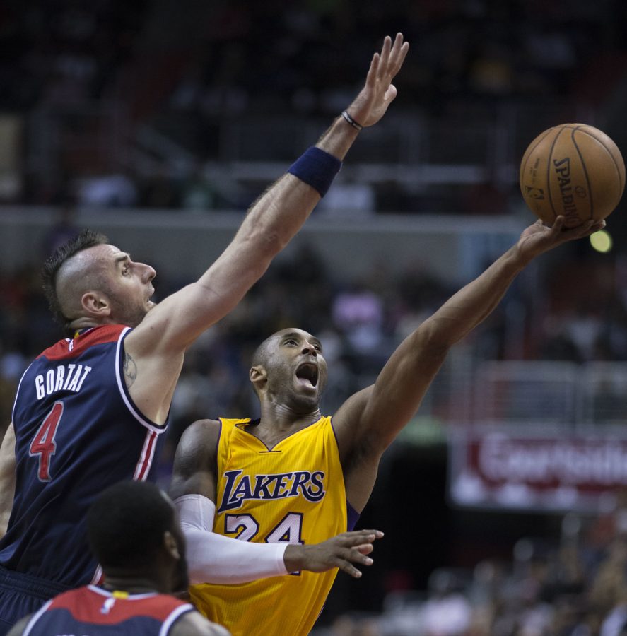 Kobe Bryant shoots over the outstretched arm of Washington Wizards defender Marcin Gortat. He went on to score 29 points as the Lakers lost 111-95 to the Wizards on December 3, 2014.