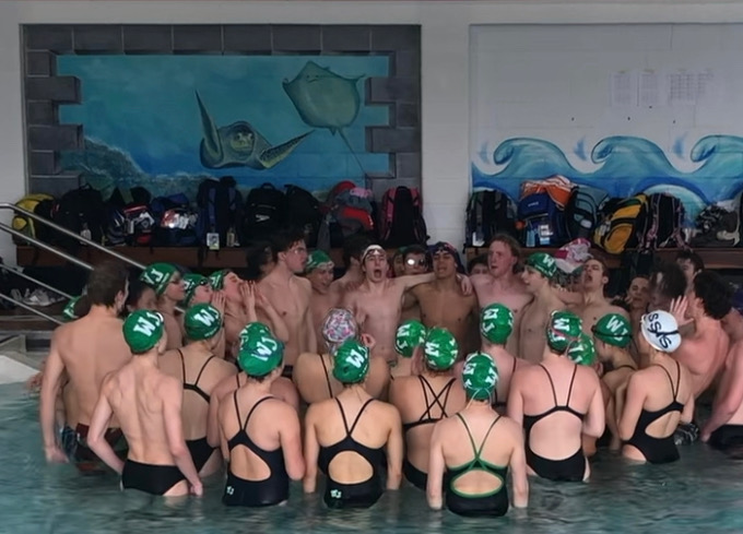 WJ Swim and Dive show team spirit at a meet against Wootton. The swim team along with other winter sports at WJ were very lucky to have a whole season this year.