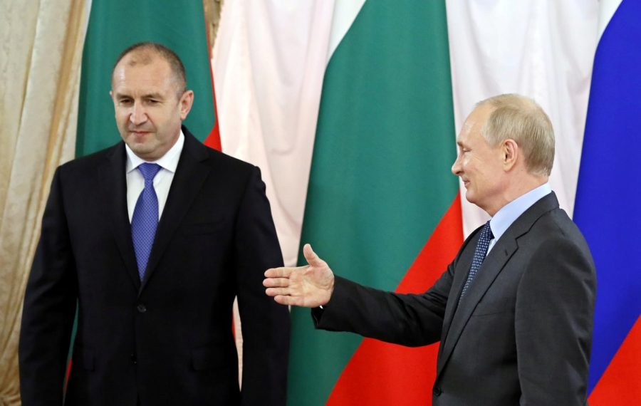 Russian President Vladimir Putin (right) gestures to handshake with Bulgarian President Rumen Radev (left) during their bilateral meeting on Sept. 2021.