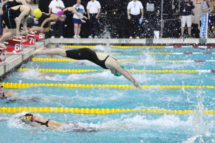 Senior Lianna Rosman diving into her successful swimming season. She recently committed to Bates College to continue her academics and swimming career.