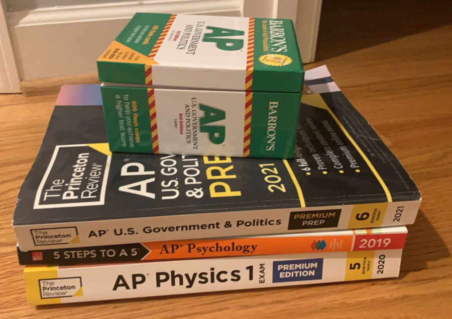 This photo includes many AP study resources for upcoming AP exams. Both flashcards and AP course books help students prepare for their AP exams.