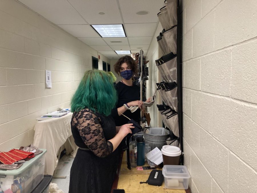 Two of the sound crew members, sophomores Shira Levy and Belia Lemelin carefully look at the mics that will be used. Mics are carefully numbered and assigned to characters so that it is easily identifiable when problems arise.