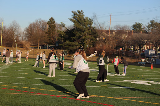 The field filled up with many eager girls trying out for lacrosse. 