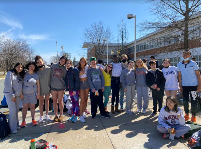 Best Buddies held a a meeting outside, where members had fun decorating the sidewalk with chalk and ate pizza.