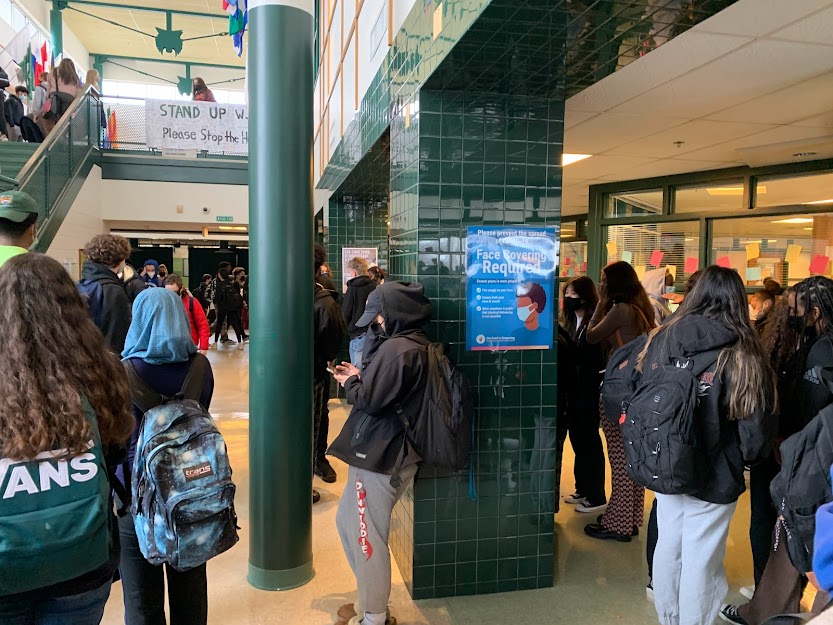 Students take care to properly mask in order to limit the spread of Covid-19 in the hallways. The issue of what public health guidelines the county should enforce has caused great debate in recent weeks.