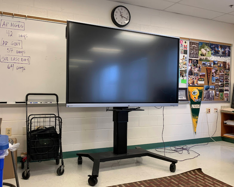 A Boxlight board stands menacingly in a classroom, awaiting its next victim. Since being installed in many classrooms around the school school this winter, their long, obtrusive legs have provided an unwelcome challenge for teachers trying to focus on their lesson plans.