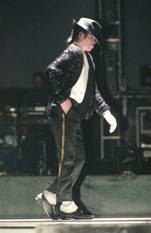 Michael Jackson does his signature moonwalk while performing smash hit Billie Jean, making the dance, song, and attire iconic.