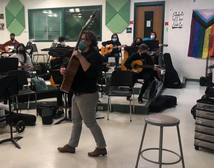 Freshman Sophia Puckett, bottom right, plays guitar in fifth period and enjoys learning it. She and her father both suffer from migraines during storms and humidity. I really want to learn and I never let it [migraines] stop what I love doing, Puckett said.