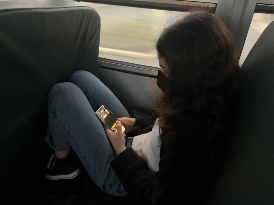 Sophomore Emma Burlina plays Wordle in the morning on the bus ride to school. I found out about Wordle through my mom; her friends were obsessed with it, Burlina said.