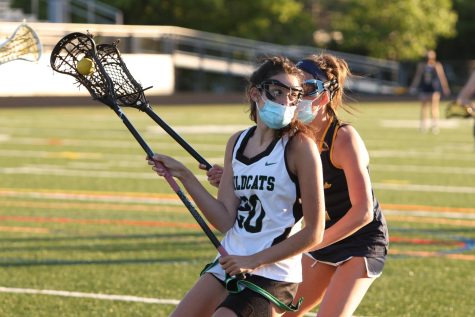 Senior Jillian Ward takes on an aggressive BCC defender in their first regular season matchup last spring. Many high school athletes have come to learn the difference between club and school sports.