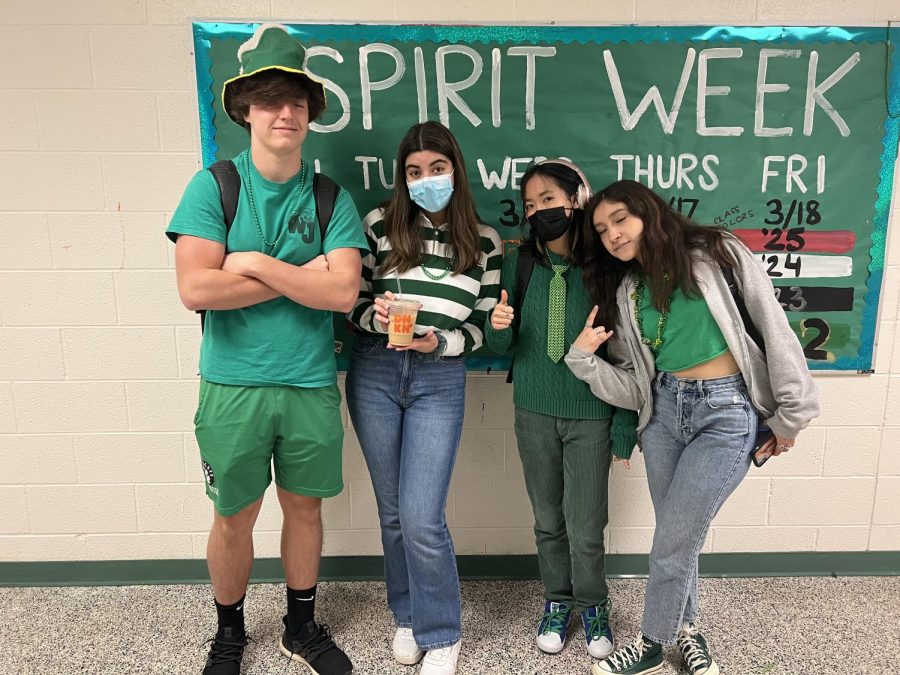From left: Seniors Will Gardner, Farah Aliabadi, Batchimeg Sukhbat and Valeria Guillen-Sanchez celebrate St. Patricks Day in their most vibrant green clothes. My favorite thing about spirit week is seeing everyone participating and showing off their spirit in their own unique way, Aliabadi said.
