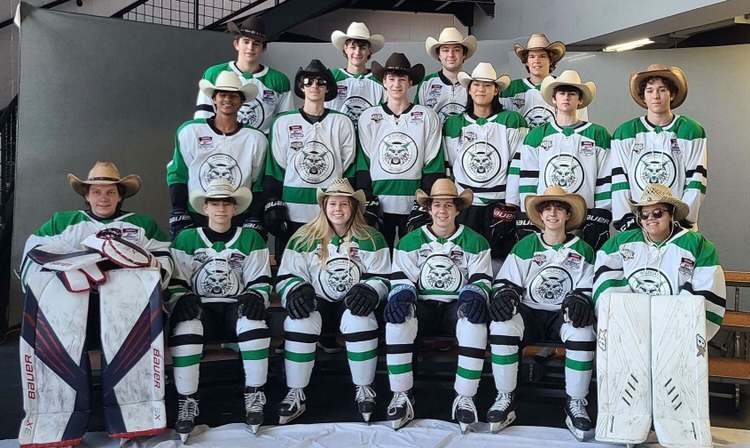 The Icecats pose for a team photo in their cowboy hats, showing off their Texas spirit. While the national tournament didnt go their way, the trip was a fun time for all.
