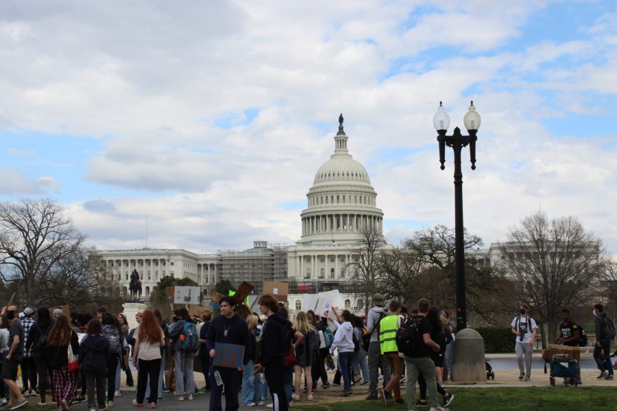 The march winds down in front of the Capitol. The protesters and organizers began to gather for speeches.