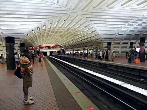 Metro riders wait for a red line train at the Metro Center station. Metro Center is one of the major transfer points in the Metro system.