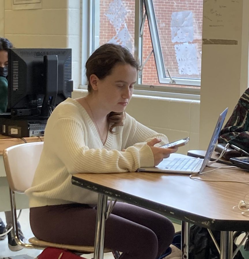 Senior and former managing editor Maeve Sanford Kelly looks on in content frustration while reading this article.